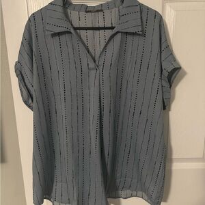 Blue and black spotted collared work blouse.